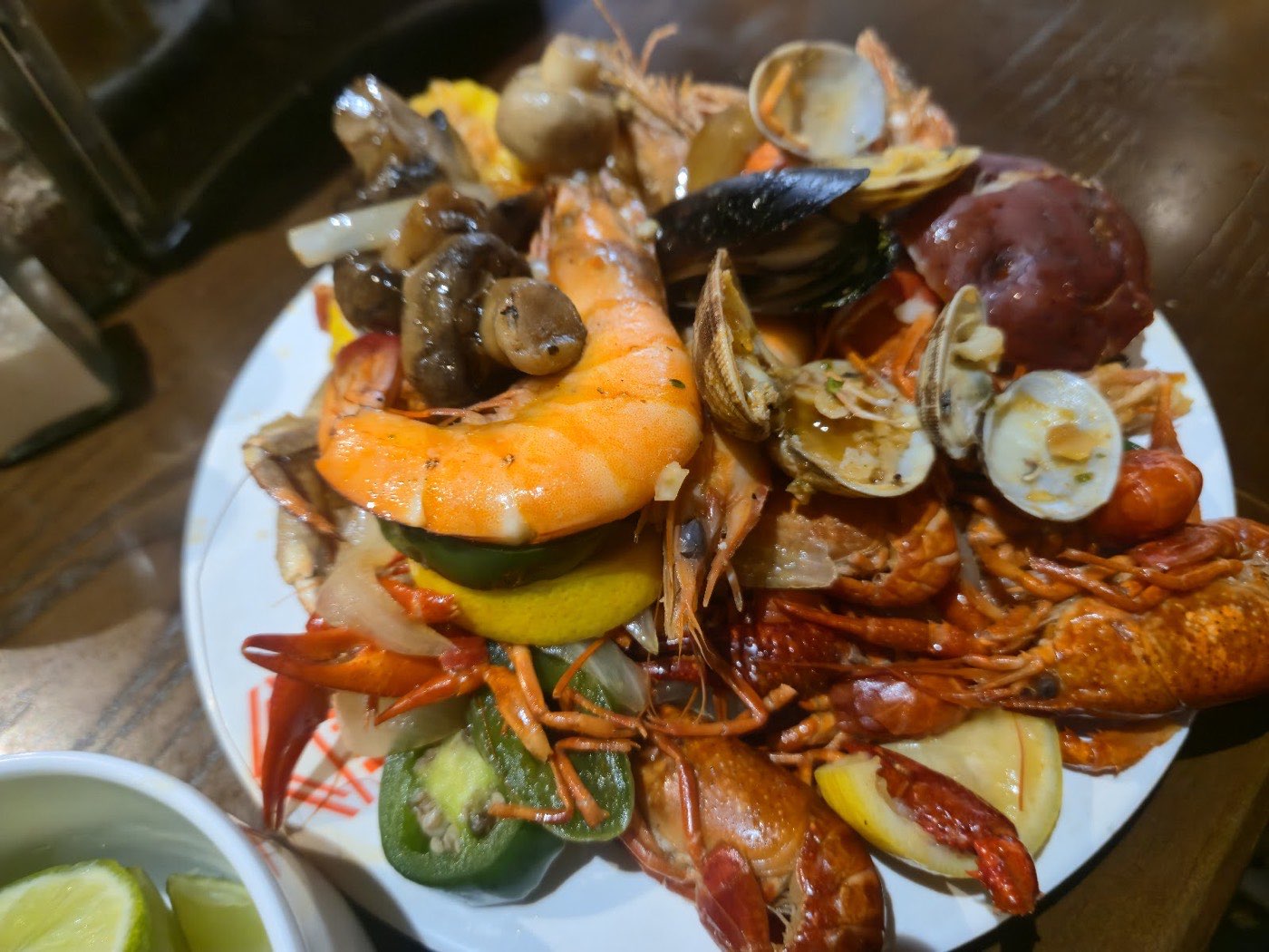 Seafood boil plate with crawfish, shrimp, mussels, and clams